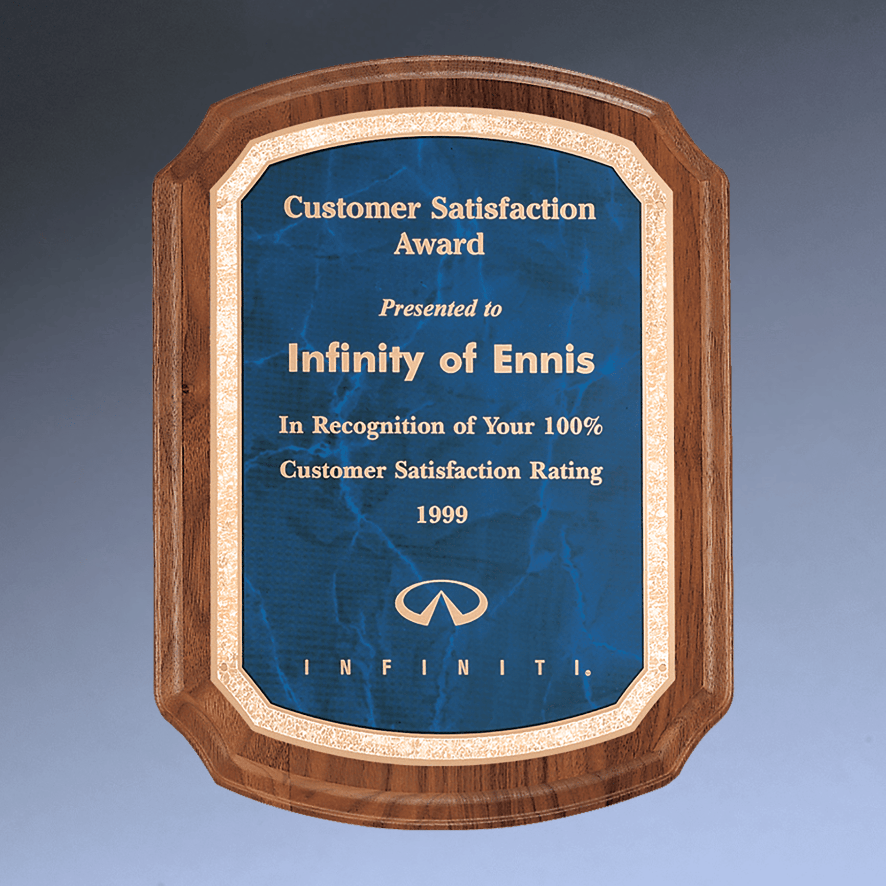 Wooden plaque with blue center and gold text