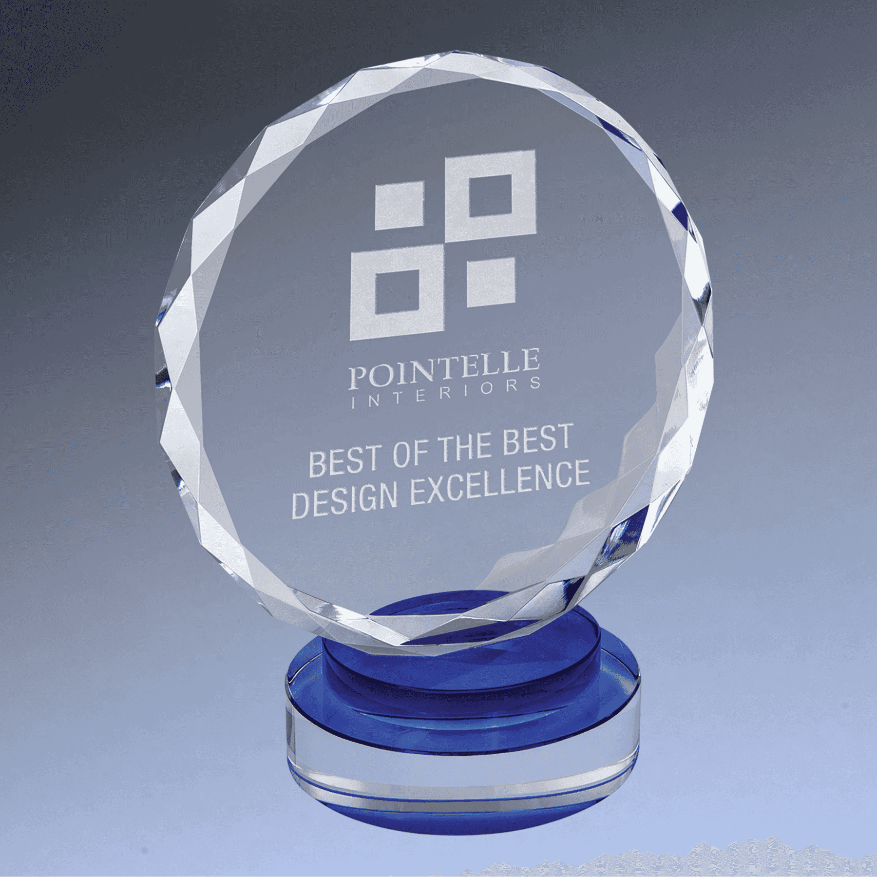Round Faceted Crystal Award with blue base, engraved for best design excellence, perfect for corporate and creative achievement recognition.